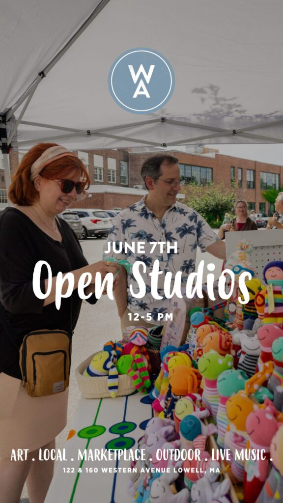 A promotional image for Western Avenue's June Open Studios event. Under a white outdoor tent, two people are smiling and browsing a colorful display of handmade plush toys. The event details are overlaid in white text: "June 7th Open Studios 12–5 PM." The Western Avenue (WA) circular blue logo is at the top. At the bottom, more text reads: "Art . Local . Marketplace . Outdoor . Live Music . 122 & 160 Western Avenue Lowell, MA." The background shows an industrial-style brick building and other visitors.